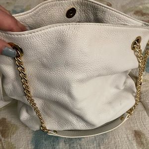 Kors Michael Kors white soft leather cross body bad with gold chains.